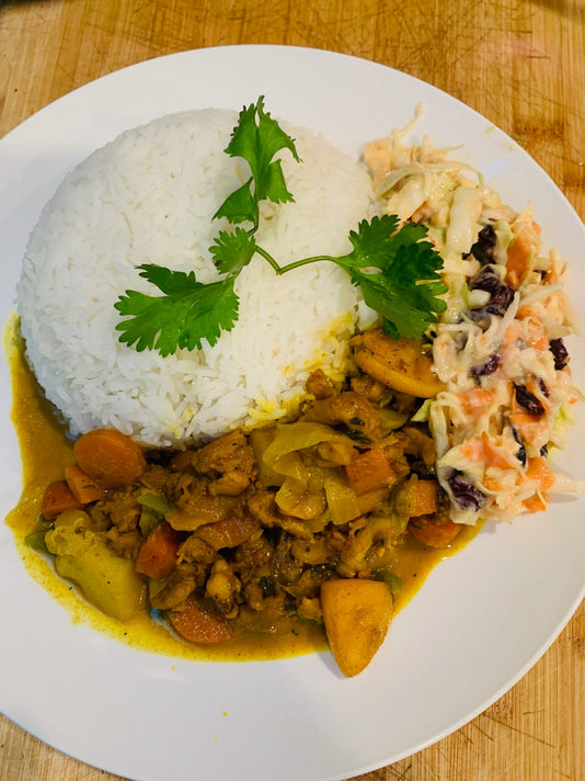 Curry conch with white rice and coleslaw