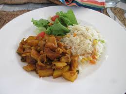 Curry conch with white rice and coleslaw